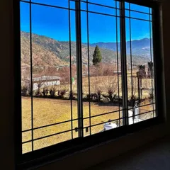 Frame your view perfectly. Our system windows with sandwiched Georgian bars offer an unobstructed, panoramic view of the mountains in Bhutan while adding a touch of classic elegance.