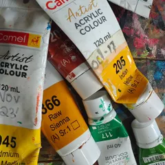Well-used tubes of artist acrylic color. These are the tools of our trade, each one holding the potential for a new creation and a new story.