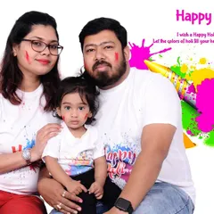 A family Holi photo with a "Happy Holi" graphic overlay. This is a great option for creating personalized festival greetings to share with friends and family.
