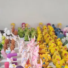 An assortment of our character miniatures, including yellow ducks, smiling frogs, and pink unicorns. These are perfect for adding a playful touch to your plant decor.