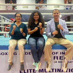 Posing in the boxing ring with my colleagues. Collaboration and sharing knowledge across different domains of sports science is how we all improve.