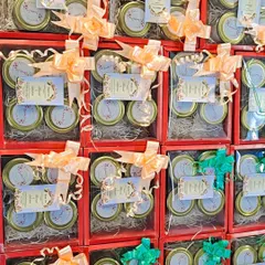 These bright red wedding hamper boxes are a simple yet elegant way to send invitations. Each box contains four jars of goodies, tied with a delicate ribbon and a personalized "Thank You" card.