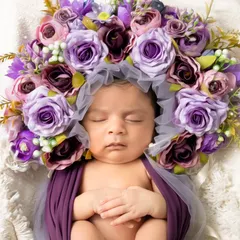 The pure innocence of a newborn. Our fine art newborn sessions are handled with the utmost care in our warm studio, using soft wraps and floral props to create timeless art.