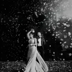 Under a sky of bubbles, the Sangeet night comes alive. I use dramatic lighting and creative angles to capture the energy of the dance floor and the couple's effortless rhythm.
