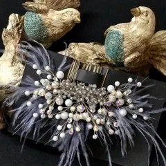 For a more modern and chic look, I love this grey feather comb. The iridescent crystals add a beautiful sparkle.