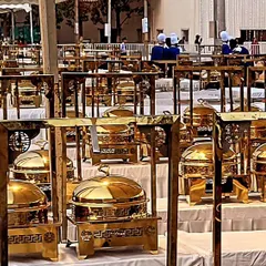 For large-scale corporate events in Bangalore, I can arrange extensive buffet lines with dozens of dishes. This setup with traditional brass chafing dishes ensures food is kept warm and presented professionally.