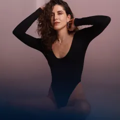 A seated pose that feels both strong and relaxed. The subtle color gradient adds a creative touch.