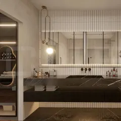 This design showcases our use of rich materials, featuring a black marble countertop and backsplash with dramatic veining. The vertical tilework and elegant pendant light add texture and a touch of glamour.