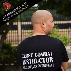 A shot of my back, wearing a "Close Combat Instructor" T-shirt for Military and Law Enforcement. The number one skill I teach is to never give up.