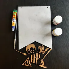 Here’s a peek inside my popular Harry Potter themed kit. Everything is included, from the wooden cutouts and banner to the paints, brush, and glue, so you can start the fun right away!