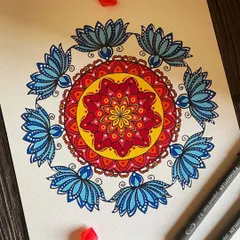 A floral-inspired piece that radiates warmth and happiness. The central design, reminiscent of a sun, is surrounded by beautiful blue lotus petals, creating a mandala that feels both energizing and peaceful.