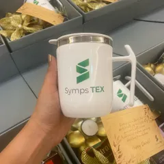 A close-up of the custom-branded mug for Symps TEX, a key feature of our popular corporate gift box.