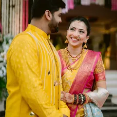 A symphony of love. The bride's joyful expression as she looks at her partner is priceless. I created a radiant look that matched her vibrant personality and colorful saree.