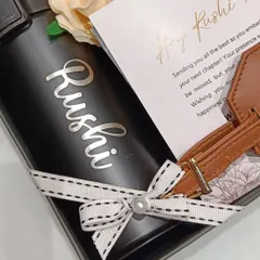 A close-up of the personalized coffee sipper for Rushi. The custom font and placement make it a stylish and personal accessory for his new journey.