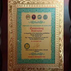 The official plaque recognizing me as an "Outstanding Instructor" for my contributions to the development of ITF Taekwon-do in India.