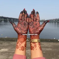 A beautiful dark stain on a floral design, photographed outdoors to show the true richness of the color against the skin.