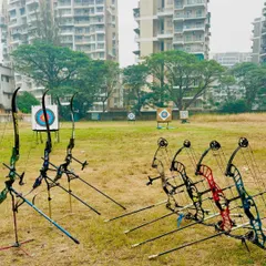 A mix of recurve and compound bows at our practice ground. This shows the variety of archery styles we teach and support at our academy.