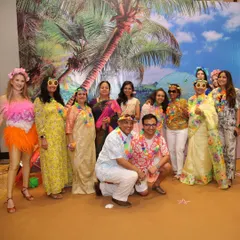 Guests having a great time at the Hawaiian-themed party. I can arrange for themed props like floral leis and fun sunglasses to help everyone get into the spirit.