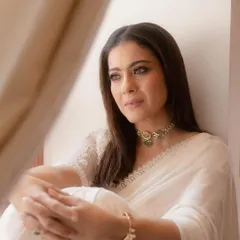 A serene portrait capturing the ethereal quality of the white-on-white look. The soft light and thoughtful expression highlight the timeless beauty of a well-draped saree.