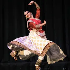 This image captures the powerful storytelling aspect of Kathak, where every movement and expression conveys a narrative. This dancer is in the middle of a dynamic spin, showcasing the energy of the form.