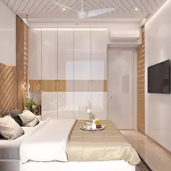 This is the same bedroom as my featured one, seen from a different angle. You can see how the textured wall panel opposite the bed complements the chevron headboard and integrates the TV seamlessly.