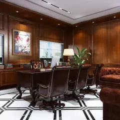 An alternate view of the director's cabin, showcasing the seating arrangement for executive meetings. The layout provides a formal yet comfortable setting, with classic leather chairs and ample space for discussion.
