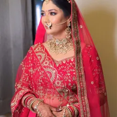 A side profile of my beautiful Udaipur bride, showcasing the perfectly set dupatta and the harmony between her makeup and her exquisite Polki jewellery.