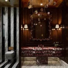 A boutique washroom visualization that exudes drama. I focused on rendering the rich red marble vanity and the dark, moody wood paneling, with an ornate mirror and artistic ceiling mural adding layers of opulence.