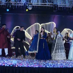 The entire family joins in for a group performance. My role as an emcee is to guide these moments and ensure everyone on stage has a fantastic time.