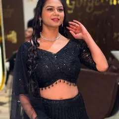 This is a great example of my HD party makeup. We created a fresh, glowing look with defined eyes and a natural lip color that perfectly complements her sparkling black lehenga. It's a glamorous yet comfortable style, ideal for a sangeet, cocktail night, or reception party.