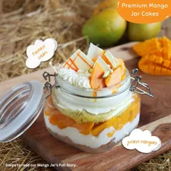 Our premium Mango Jar Cakes are a journey of flavour. This one features the freshest cream, juiciest mangoes, and a crumbly base, all layered in a cute reusable jar.