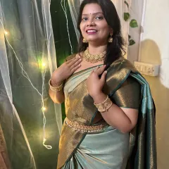 A client looking serene and beautiful in our temple jewellery choker, earrings, and kambarpatta. The matt gold finish gives a very authentic and traditional feel.