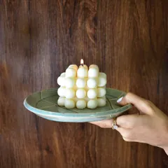 Indulge in the gentle glow of my hand-poured creations. This large bubble candle looks stunning on a ceramic plate, adding a touch of modern elegance.
