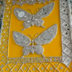 This completed Lippan art panel showcases the beautiful combination of textured clay and reflective mirror work. In our classes, you'll create your own decorative piece from start to finish.