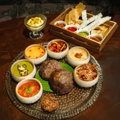 Our special Navratri Thali, a beautiful and complete meal for those observing the fast or simply wishing to enjoy festive food. It features a variety of flavorful vegetarian dishes.
