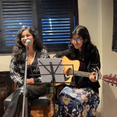 A shot of our acoustic duo setup at the Indian Origin restaurant. We provide our own sound equipment, including mics and stands, to ensure a professional performance.