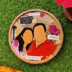 A custom faceless portrait painted on a slice of wood. This unique style focuses on color, form, and personal details to capture the essence of a couple, making for a very modern and artistic anniversary gift.