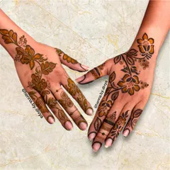 This is another beautiful example of a floral vine or "bel" in the Arabic style. The pattern gracefully adorns the back of the hands, making it a popular choice for engagements and parties.