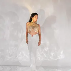 This full-length shot for Filmfare showcases the entire ensemble against a clean, high-key background. The lighting setup was designed to create interesting shadow play while keeping the focus on the subject.