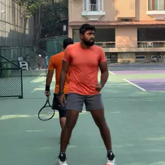 One of our head coaches on court, demonstrating the readiness and intensity that he expects from all his players during a training session.