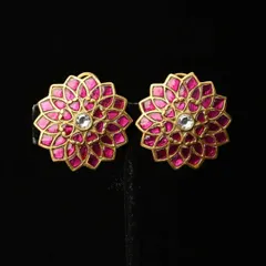A pair of beautiful floral studs with vibrant pink meenakari enamel work. The gold-toned petals surround a single white stone at the center, creating a bright and cheerful look.