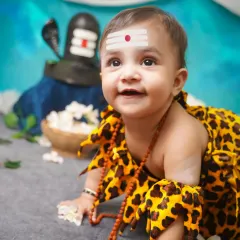 Capturing the divine innocence of a baby is a blessing. This close-up from our little Shivji themed shoot shows the adorable details and peaceful expressions we focus on in our culturally inspired sessions.
