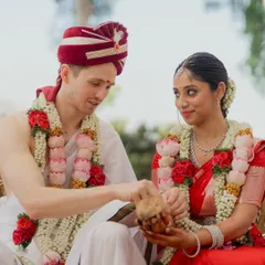 A beautiful moment of cultural exchange during a South Indian wedding ceremony. We focus on these small, meaningful interactions that tell a larger story of two families coming together.