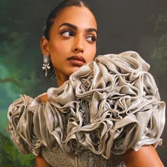 The sculptural 3D rose detail on the Bellerose Gown. Each fold of fabric is carefully shaped and stitched by hand to create the impression of a blooming rose.