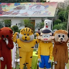 We have a whole team of characters ready for your event. This photo shows a lineup of our mascots, including a bear, tiger, and Nobita, perfect for a carnival or large party.