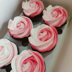 These two-tone rosette cupcakes are simple, elegant, and so pretty. The blend of pink and white frosting off creates a beautiful floral effect, perfect for a baptism or bridal shower.
