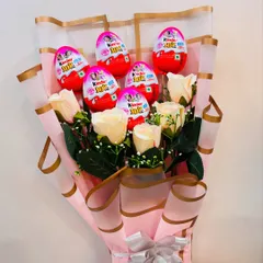 A bouquet that's sweet in every way. This arrangement combines artificial roses with Kinder Joy chocolates, making it a perfect and playful gift for someone special.