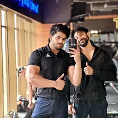 Progress is a team effort. Here I am with a client, both of us working towards our goals. A good coach is a training partner who pushes you to be better.