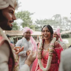 The look of pure delight on the bride's face during the Varmala ceremony. We focus on capturing these fleeting expressions that tell a story of love and happiness.