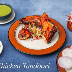 A full plate of our Chicken Tandoori, marinated in a blend of spices and yogurt before being roasted in the tandoor. The result is juicy chicken with a signature smoky char.